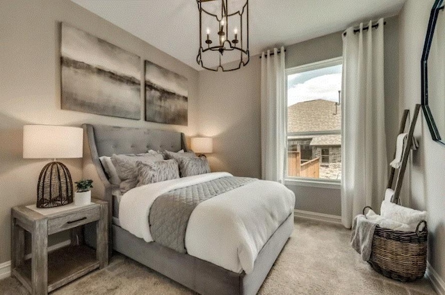 carpeted bedroom featuring a textured ceiling and a notable chandelier