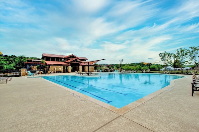 view of pool featuring a patio