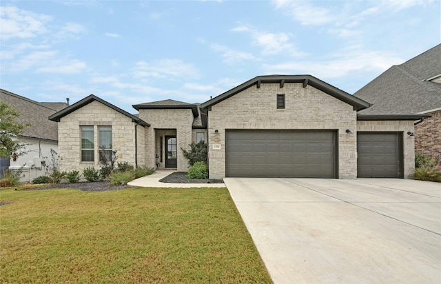 view of front facade with a front yard and a garage