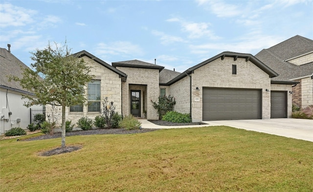 view of front of property with a front yard and a garage