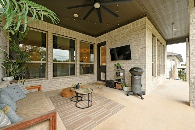 view of patio / terrace featuring ceiling fan