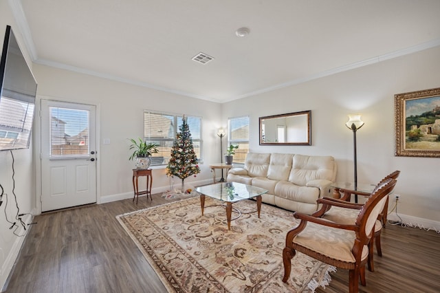 living room with dark wood-type flooring and crown molding