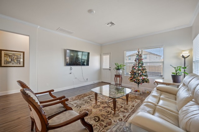 living room featuring dark hardwood / wood-style flooring and ornamental molding