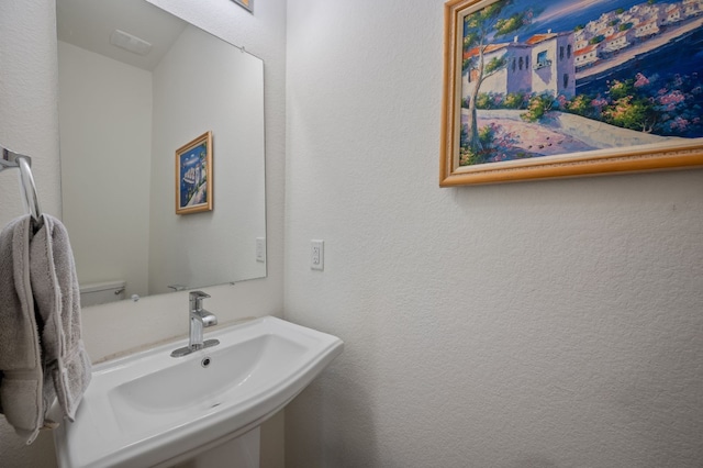 bathroom with sink and toilet