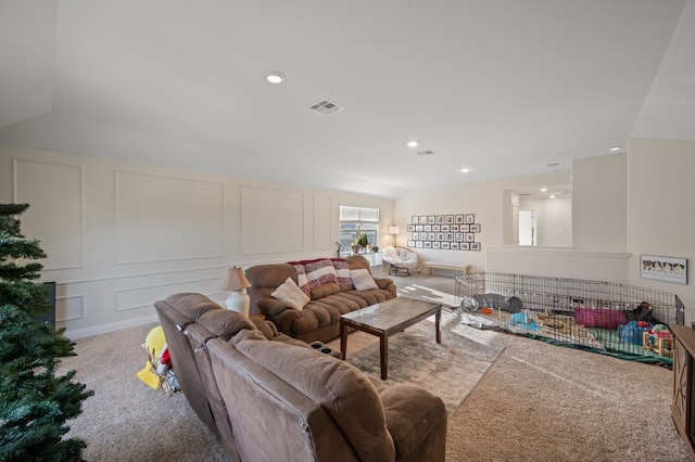 living room featuring carpet and lofted ceiling