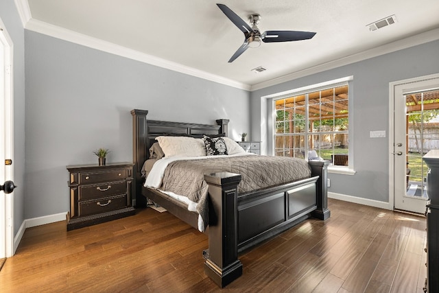 bedroom featuring ceiling fan, dark hardwood / wood-style floors, access to outside, and multiple windows