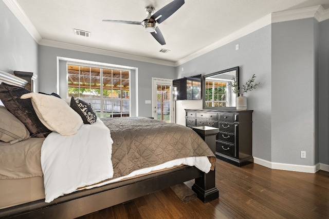 bedroom featuring dark hardwood / wood-style floors, ceiling fan, ornamental molding, and multiple windows