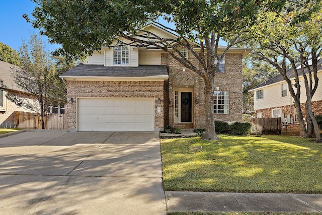 view of property with a front yard and a garage