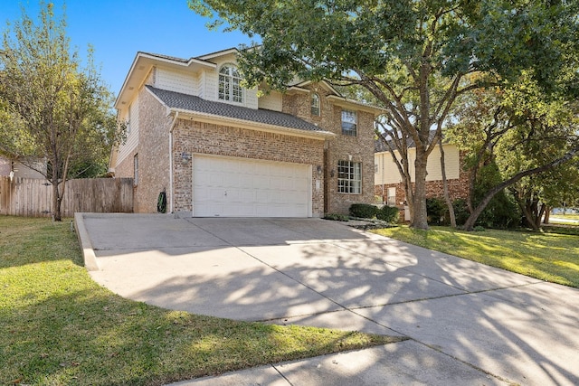 view of front of house featuring a garage and a front yard