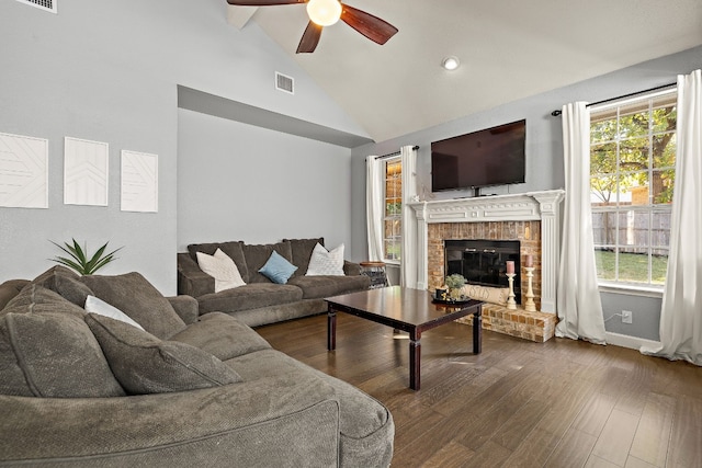 living room with ceiling fan, a fireplace, a healthy amount of sunlight, and hardwood / wood-style flooring