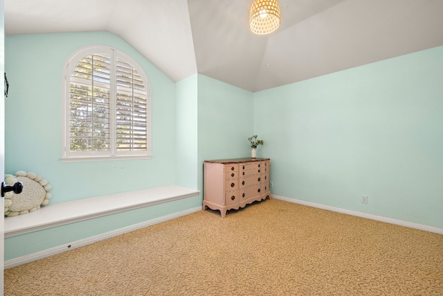 living area featuring carpet and lofted ceiling