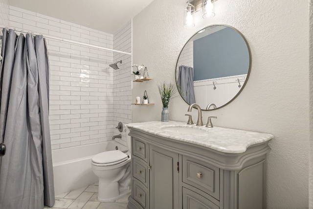 full bathroom featuring shower / tub combo, vanity, and toilet