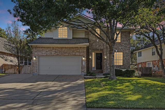 view of front facade with a lawn and a garage