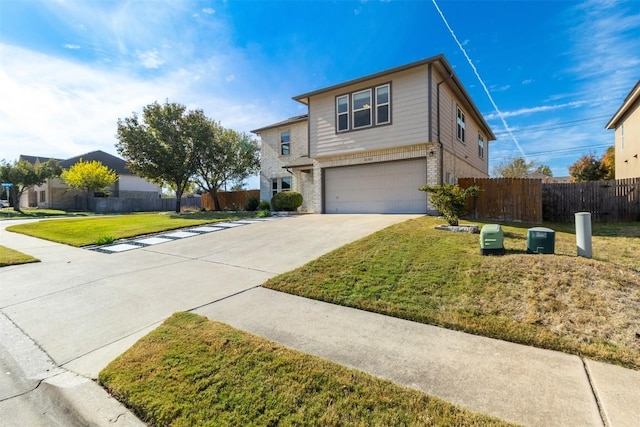 view of property with a front yard and a garage