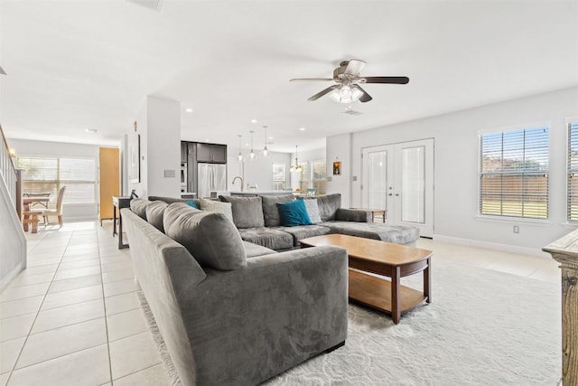 tiled living room featuring ceiling fan