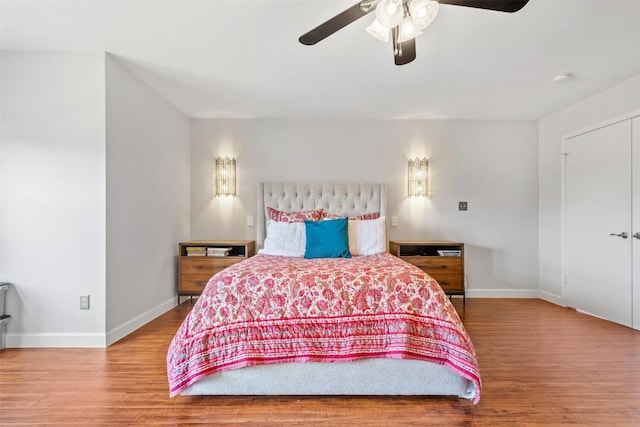 bedroom with hardwood / wood-style floors and ceiling fan