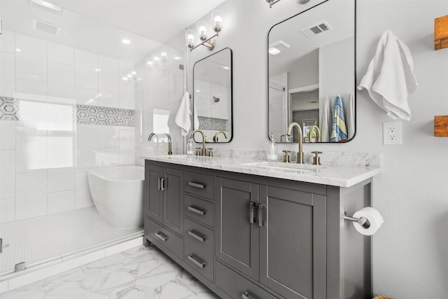 bathroom featuring vanity and separate shower and tub