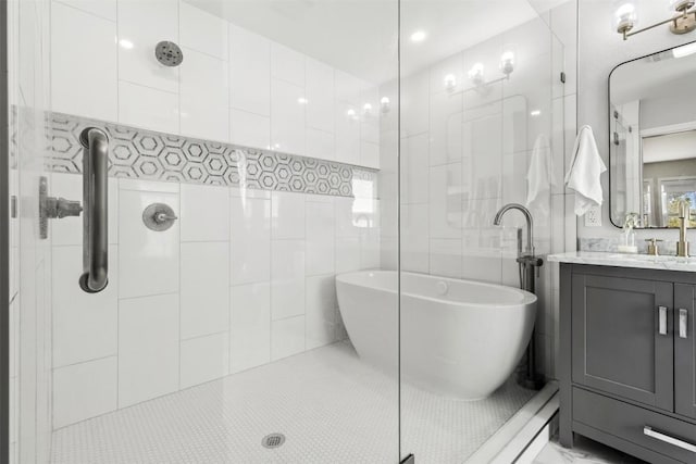 bathroom featuring tile patterned flooring, vanity, separate shower and tub, and tile walls