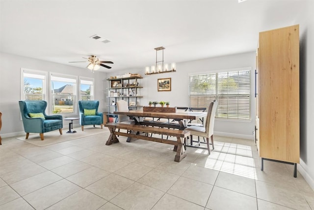 dining room featuring a wealth of natural light, ceiling fan, and light tile patterned floors