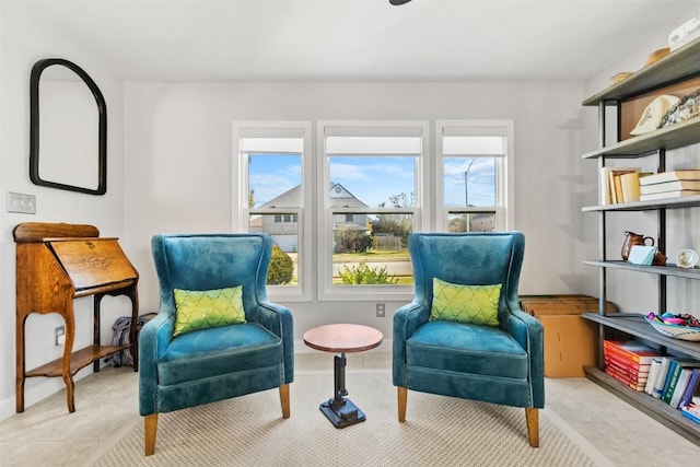 sitting room featuring light tile patterned floors