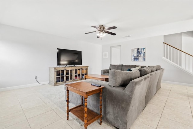 living room featuring ceiling fan and light tile patterned flooring