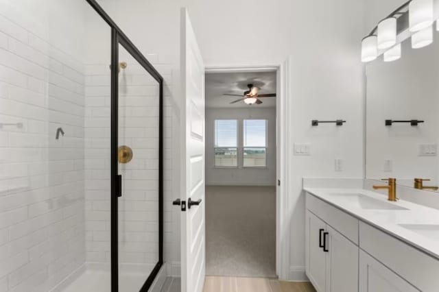 bathroom with ceiling fan, hardwood / wood-style floors, vanity, and a shower with shower door