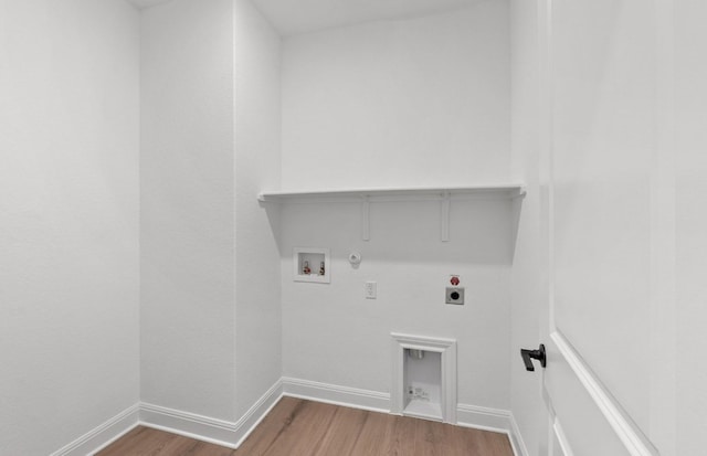 217 Canyoncrest Way, Liberty Hill, TX 78642 - laundry area with hookup for a gas dryer, electric dryer hookup, washer hookup, and wood finished floors