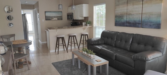 living room with light tile patterned floors