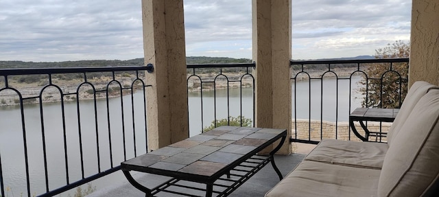 balcony with radiator heating unit and a water view