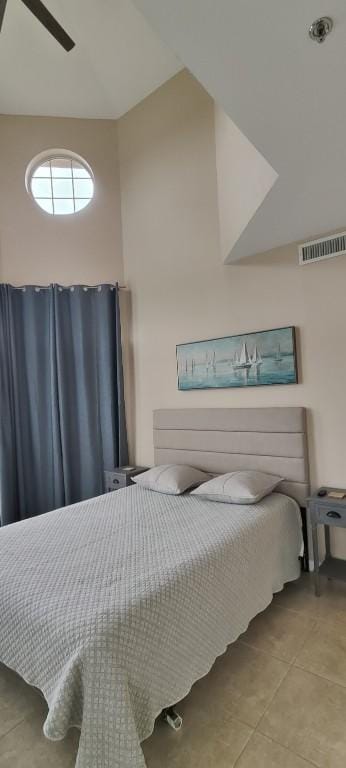 bedroom featuring ceiling fan and light tile patterned floors