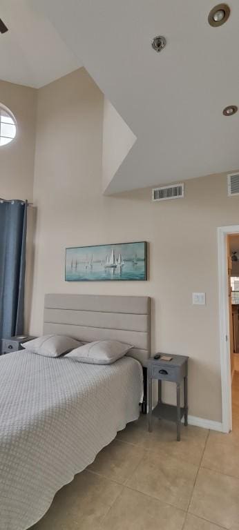 bedroom with light tile patterned flooring