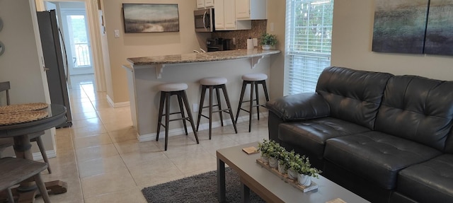 living room featuring light tile patterned floors