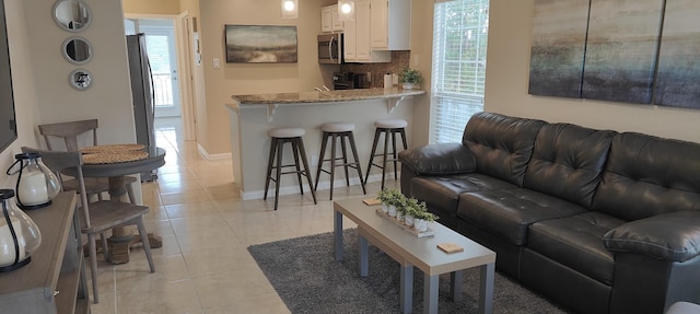 living room with light tile patterned floors