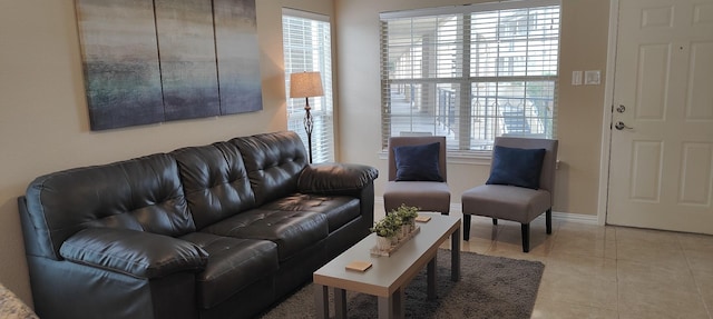 living room with plenty of natural light and light tile patterned floors