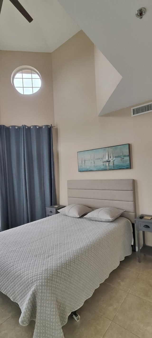 bedroom featuring light tile patterned floors and ceiling fan