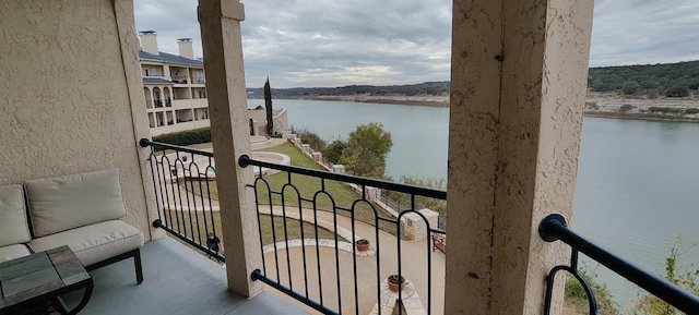 balcony featuring a water view