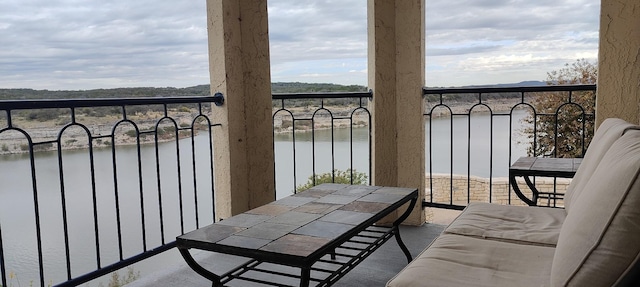 balcony with a water view and radiator heating unit