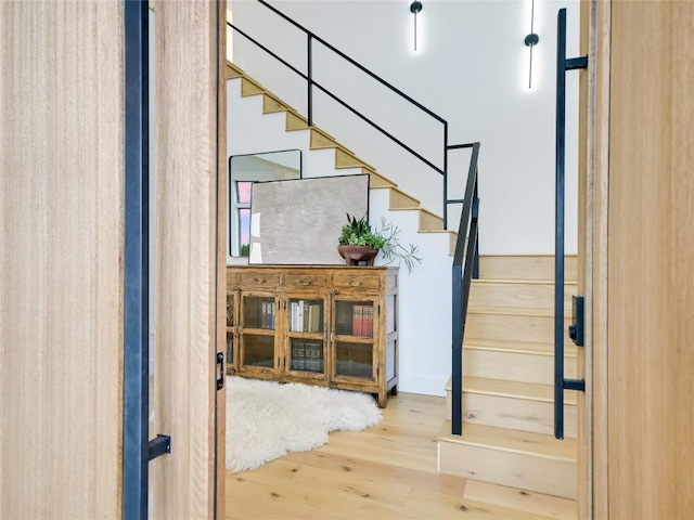 stairway with wood-type flooring