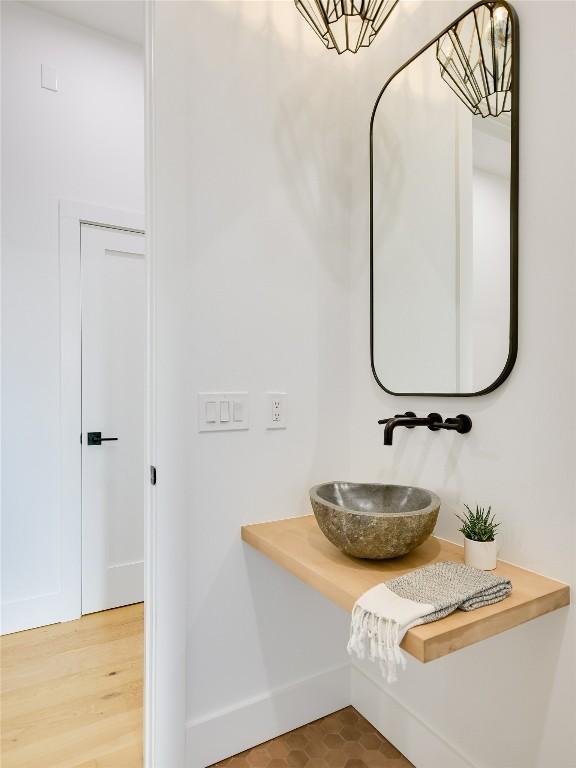 bathroom with sink and hardwood / wood-style floors