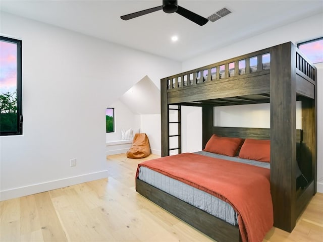 bedroom with hardwood / wood-style flooring and ceiling fan