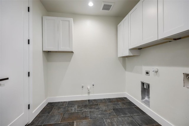 laundry room featuring electric dryer hookup, hookup for a gas dryer, cabinets, and washer hookup