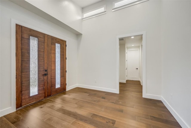 foyer entrance featuring hardwood / wood-style floors