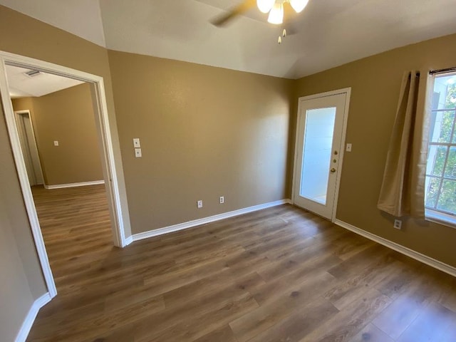 1005 N Lbj Dr Unit A-5, San Marcos, TX 78666 - spare room featuring dark wood-style flooring, ceiling fan, and baseboards