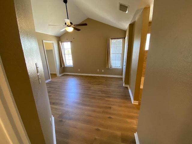 1005 N Lbj Dr Unit A-5, San Marcos, TX 78666 - spare room with ceiling fan, wood finished floors, lofted ceiling, baseboards, and a textured wall
