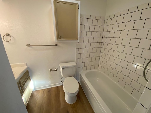 1005 N Lbj Dr Unit A-5, San Marcos, TX 78666 - bathroom featuring baseboards, wood finished floors, toilet, and vanity