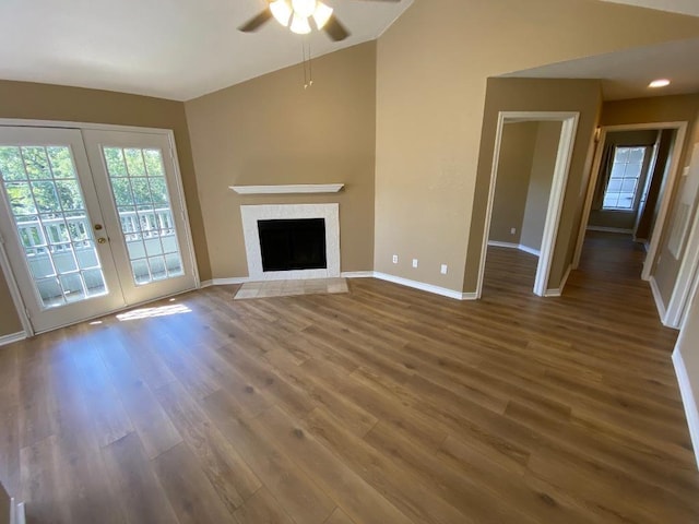 1005 N Lbj Dr Unit A-5, San Marcos, TX 78666 - unfurnished living room with lofted ceiling, a ceiling fan, healthy amount of natural light, french doors, and baseboards