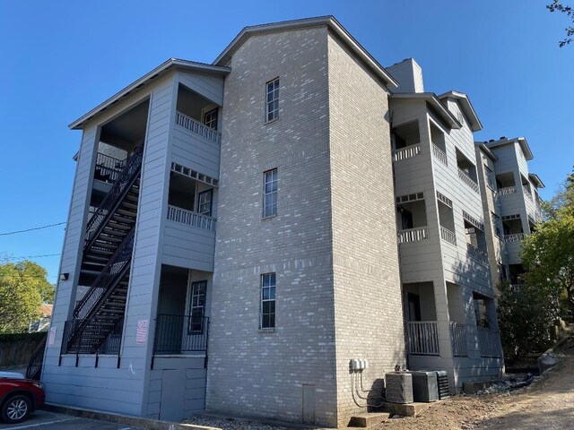 1005 N Lbj Dr Unit A-5, San Marcos, TX 78666 - view of apartment building / complex with central AC