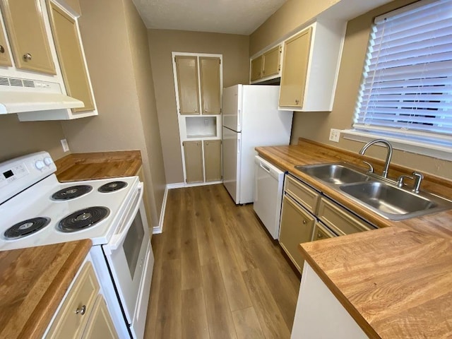 1005 N Lbj Dr Unit A-5, San Marcos, TX 78666 - kitchen featuring white appliances, wood counters, a sink, under cabinet range hood, and wood finished floors