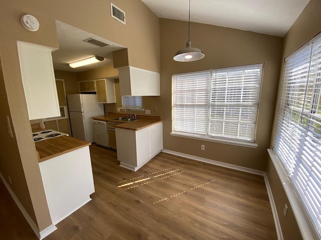 1005 N Lbj Dr Unit A-5, San Marcos, TX 78666 - kitchen with a sink, wood counters, dark wood-style flooring, freestanding refrigerator, and high vaulted ceiling