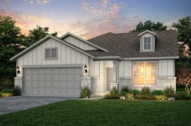 view of front facade with a lawn and a garage